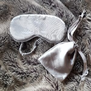 Silky grey sleep mask in silver, with travel pouch