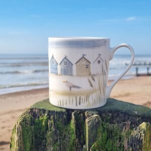 "Shoreline" coastal beach huts bone china mug by Gisela Graham
