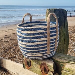 Blue striped corn husk storage basket with handles