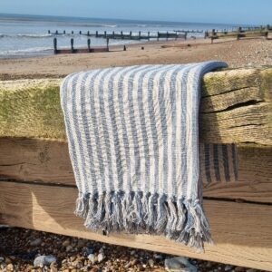 Coastal pale blue and cream stripe woven throw by Gisela Graham