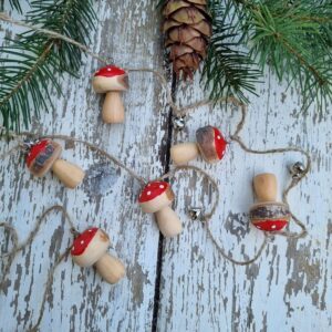 Wooden toadstool and silver bell garland
