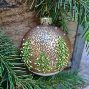 Snowy Nordic pine forest gold glass Christmas bauble