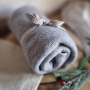 Cosy asymmetrical soft-touch poncho in dove grey, with cotton travel bag and gift tag