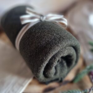 Cosy asymmetrical soft-touch poncho in khaki, with cotton travel bag and gift tag