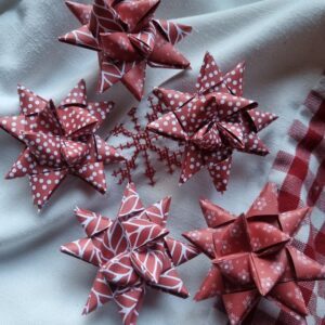 Danish woven paper Christmas star strips (stjernestrimler) in red leaves, spots and knitted design by Vivi Gade Copenhagen