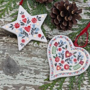 Set of two tin Alpine folk art red, blue and white Scandi Christmas ceramic star and heart by Gisela Graham