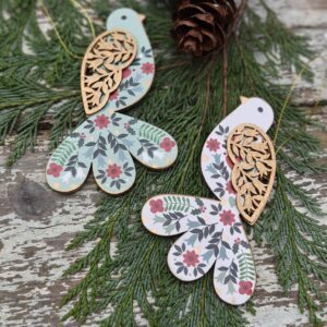 Set of two wooden Alpine folk art mint green, red and white Scandi Christmas birds by Gisela Graham