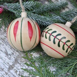 Set of two traditional natural wood alpine baubles by Gisela Graham