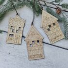 Close-up of the Scandi birch house ornaments with Nordic star and dala horse cut-outs
